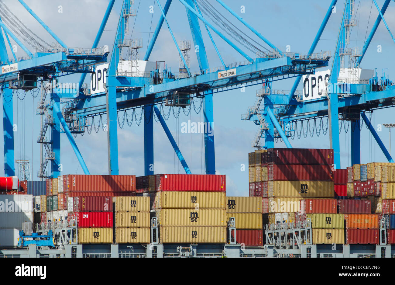 Container ship unloading at port Stock Photo - Alamy