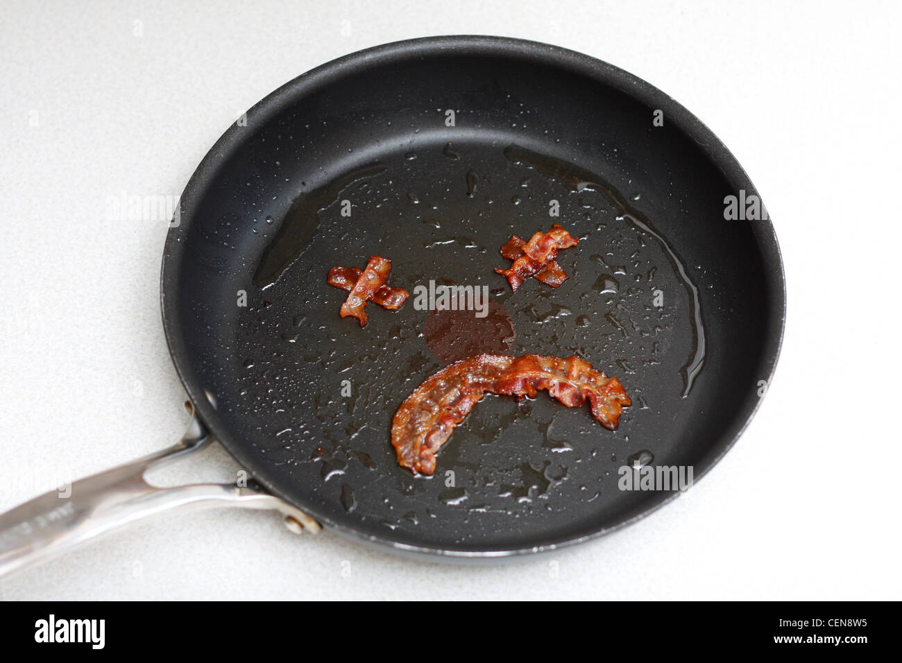 Smiley made out of bacon illustrating dangerous eating habits Stock Photo