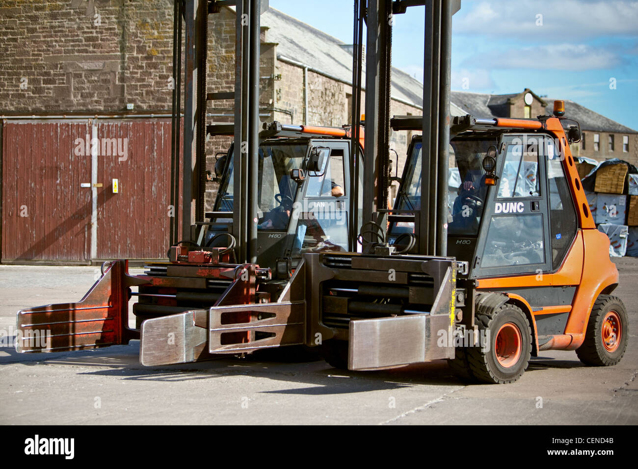 Forklifts in operation during Paper cargo operations. Montrose Harbour. Scotland. Stock Photo