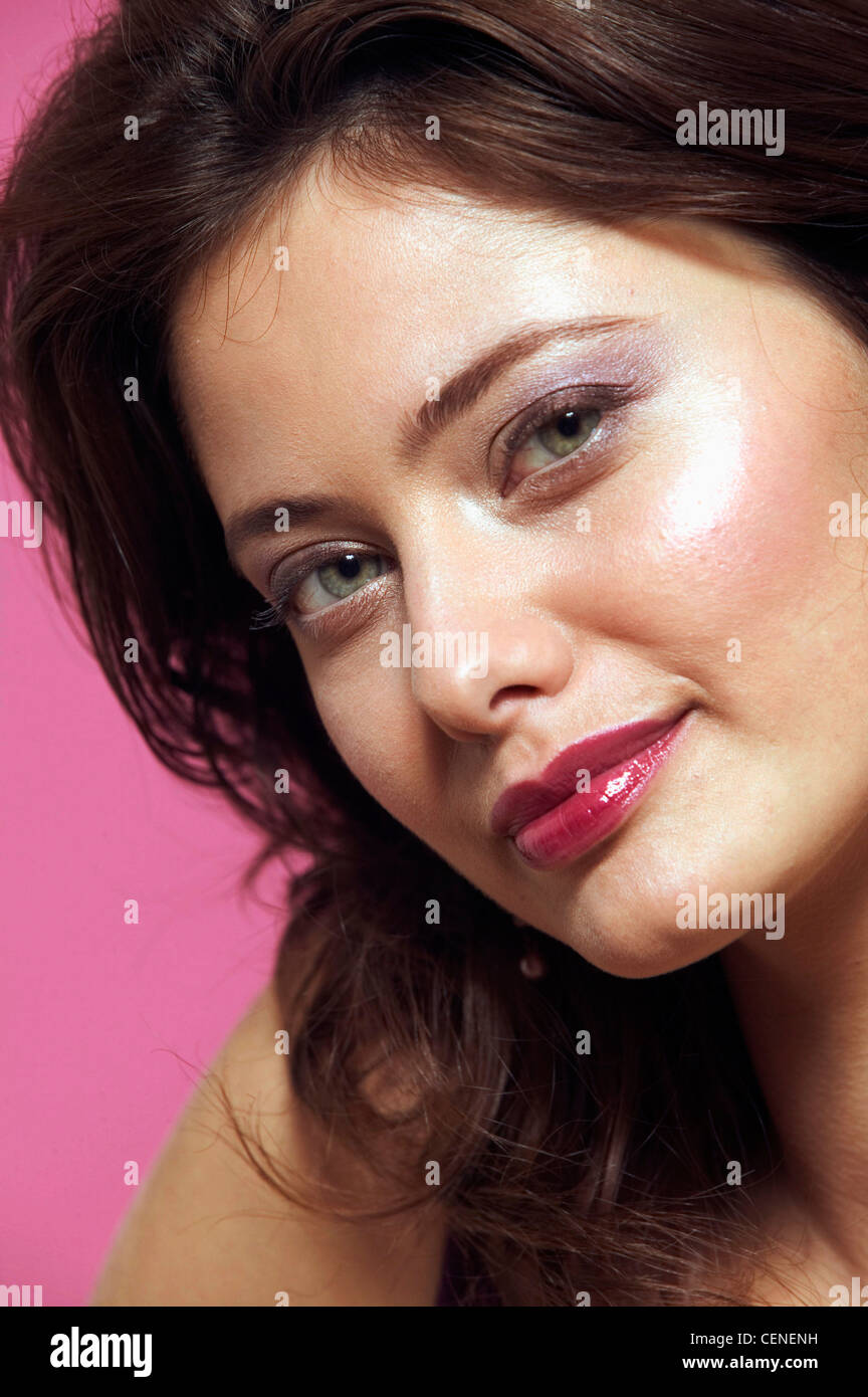 Female Curly Brunette Hair Purple Eyeshadow And Dark Red Lip