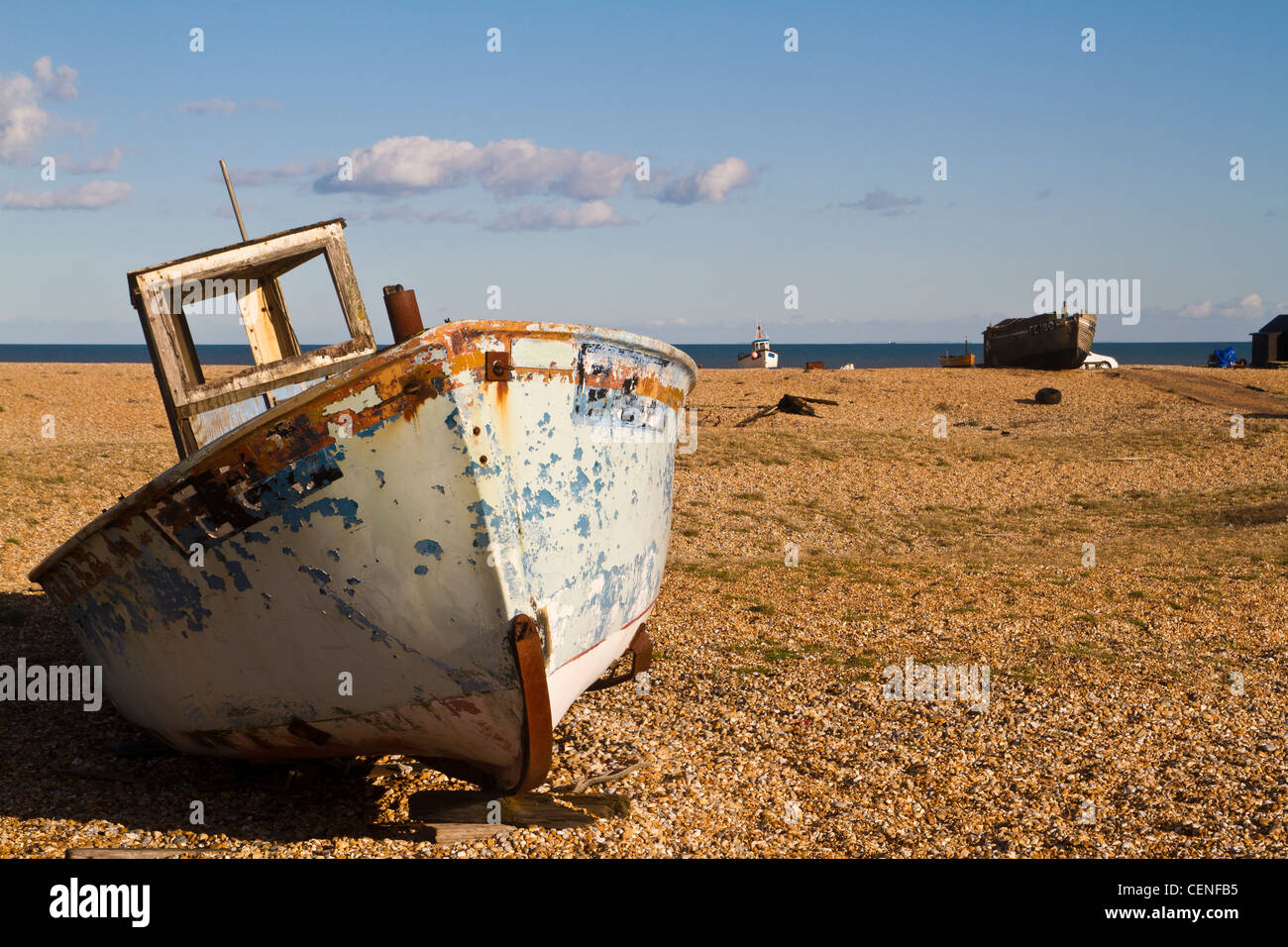 old and abandoned fishing boat on the beach in Dungeness in Kent Stock ...