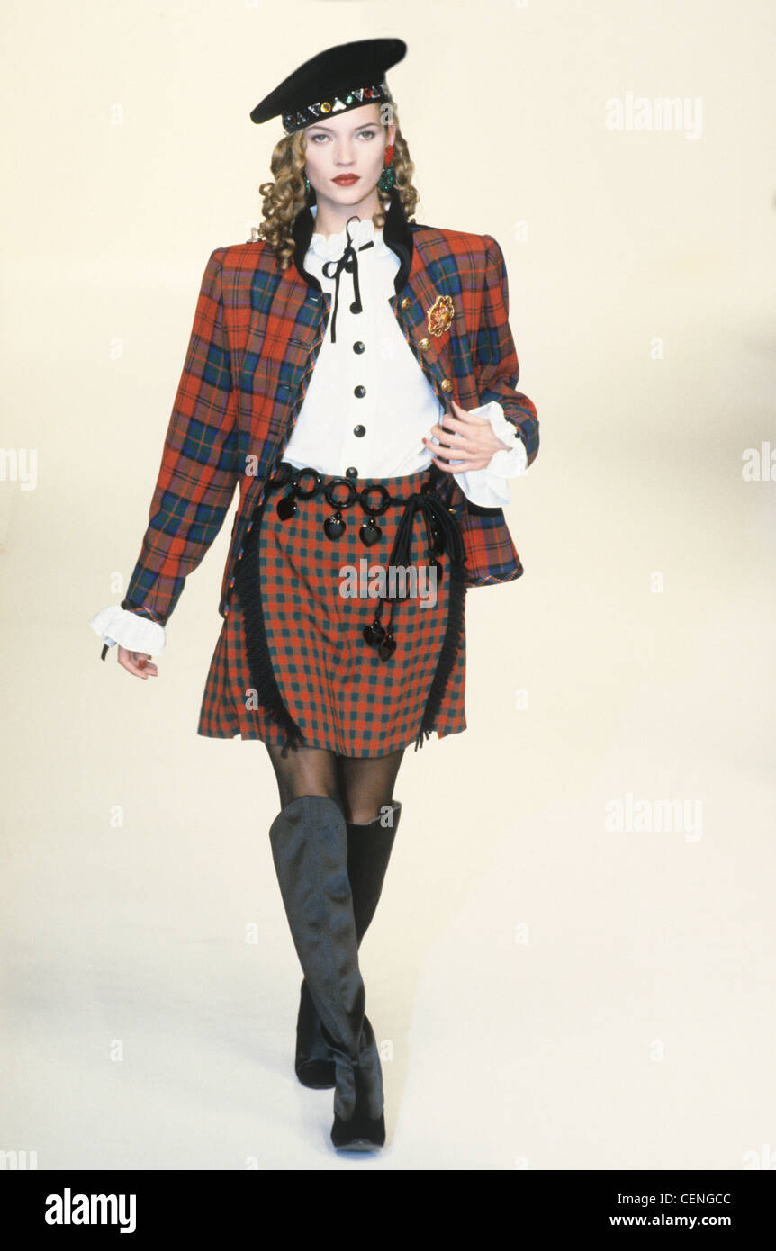 Yves Saint Laurent Autumn Winter British model Kate Moss wearing red and  blue tartan check skirt suit, white blouse navy style Stock Photo - Alamy