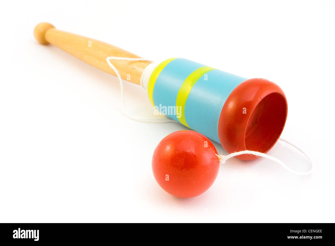Wooden ball in a cup toy over white Stock Photo