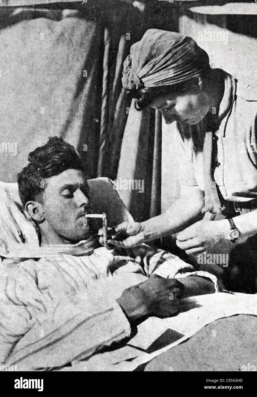 WW11. Military nurse tends a wounded soldier Stock Photo