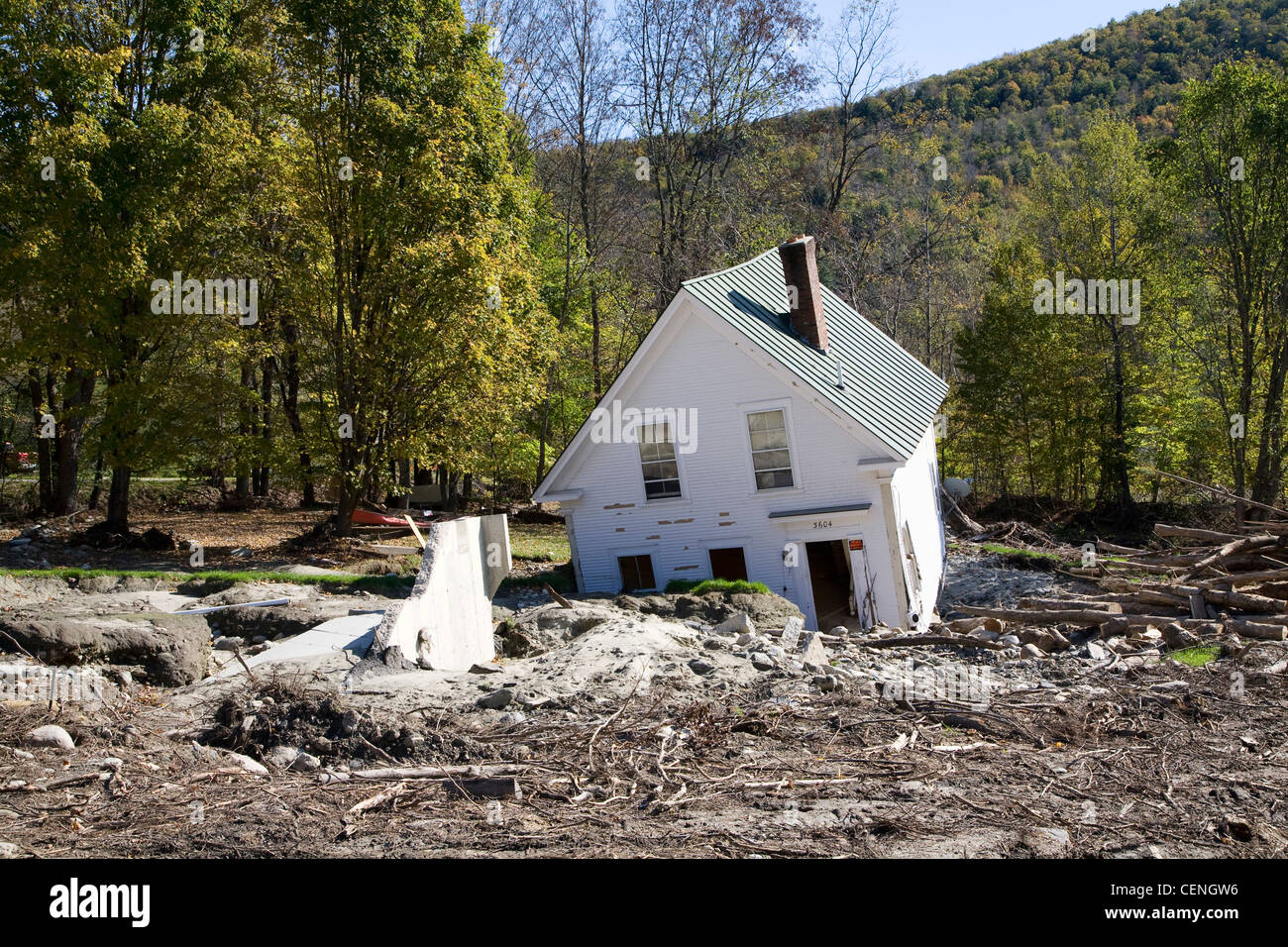 A house washed off its foundation due to flood damage in Warren Vermont along the Mad River in 2011 Stock Photo