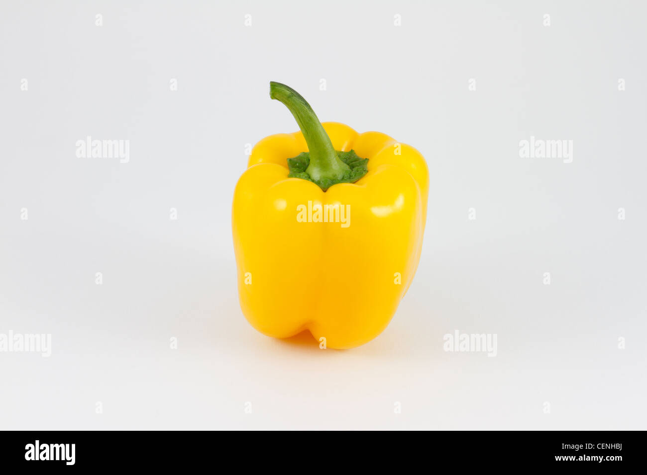 Whole yellow bell pepper, Capsicum annuum, vegetable on white background. Stock Photo