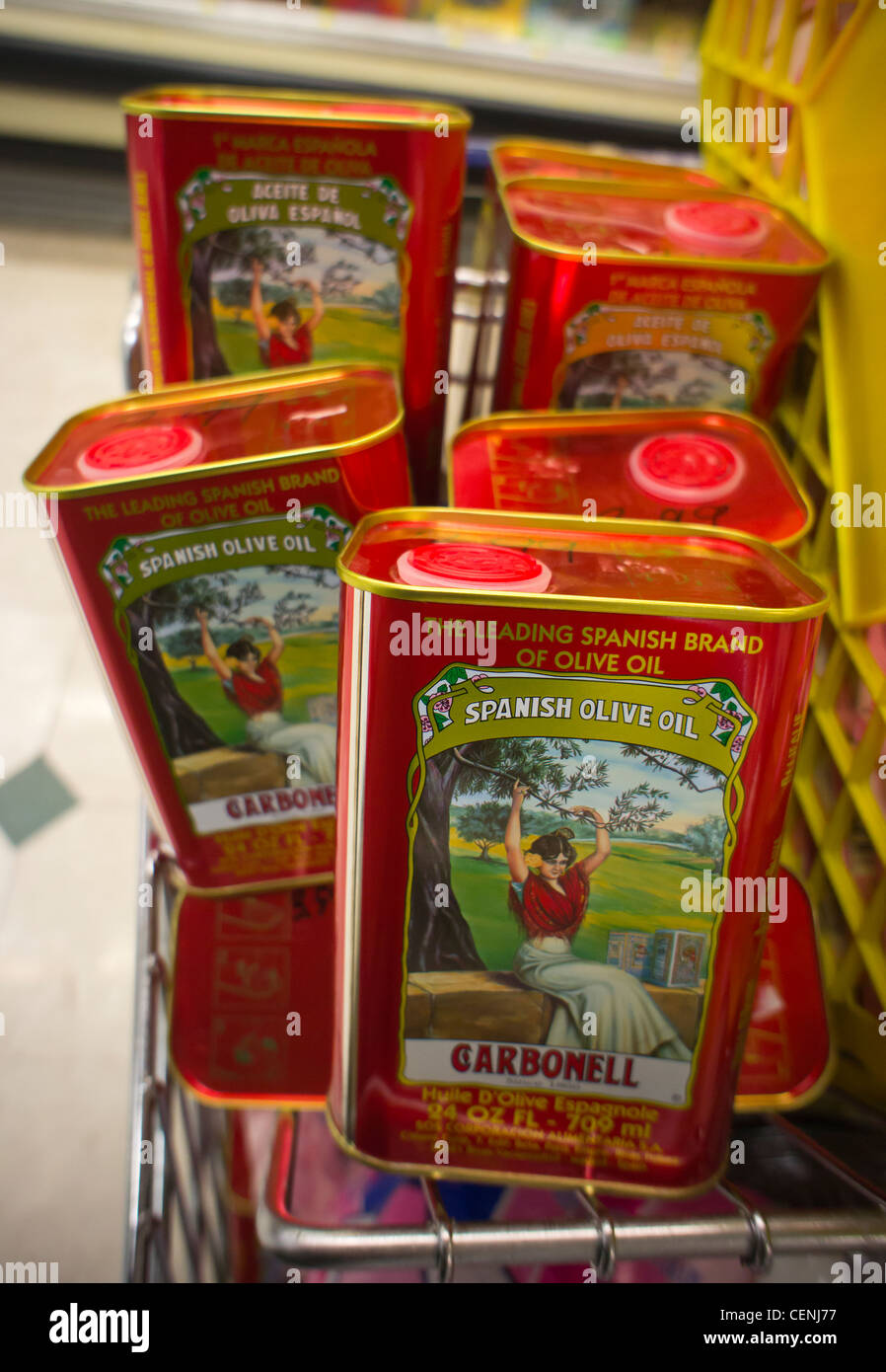 Cans of imported Spanish olive oil are seen on a supermarket shelf on