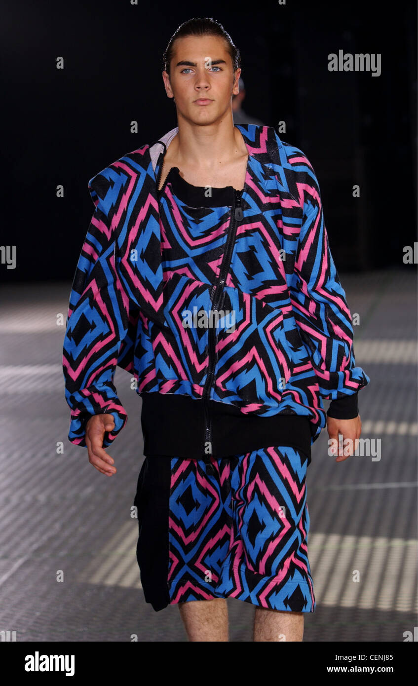Bernhard Wilhelm Paris Menswear S S Male model wearing pink and blue  patterned stripes two piece outfit casual jacket and Stock Photo - Alamy