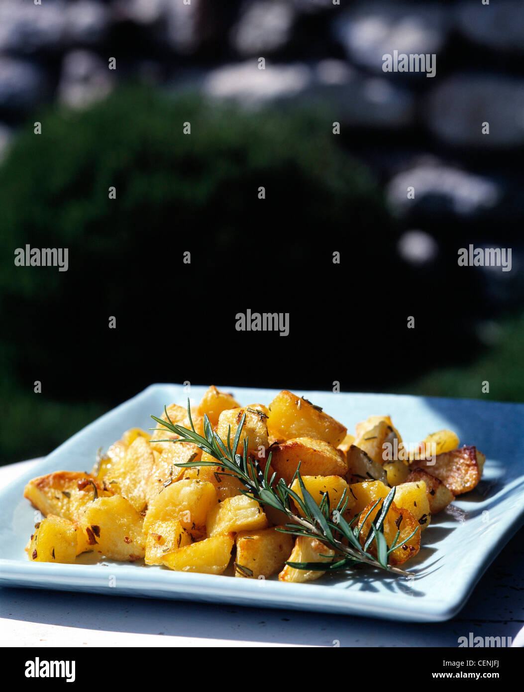 Roast Potatoes Rosemary and Garlic Preheat the oven to C, gas mark Peel