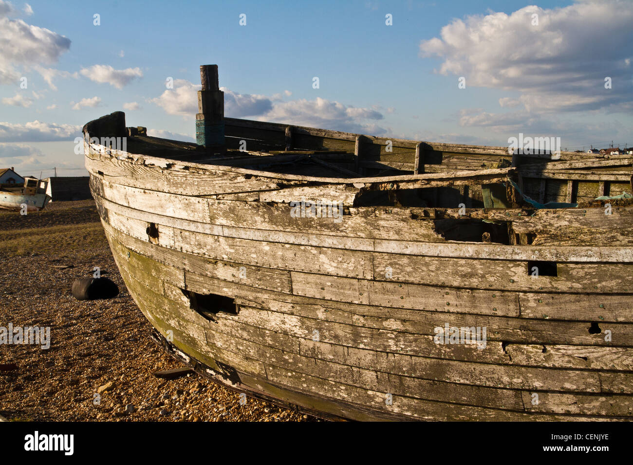 old and abandoned fishing boat on the beach in Dungeness in Kent Stock ...
