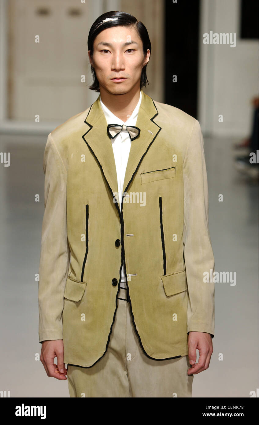 Issey Miyake Paris Menswear S S Male model wearing olive suit and  