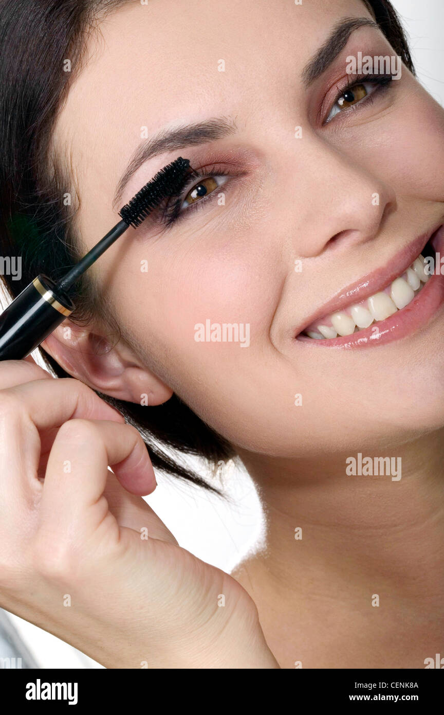 Black woman applying under eye hi-res stock photography and images - Alamy