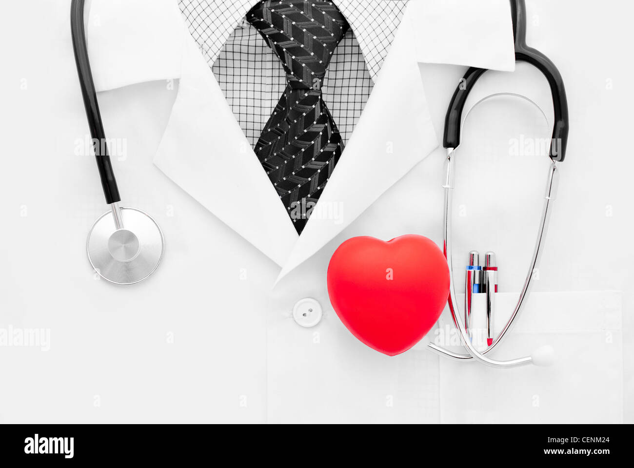 Doctor in black tie with stethoscope and heart - studio shot Stock ...