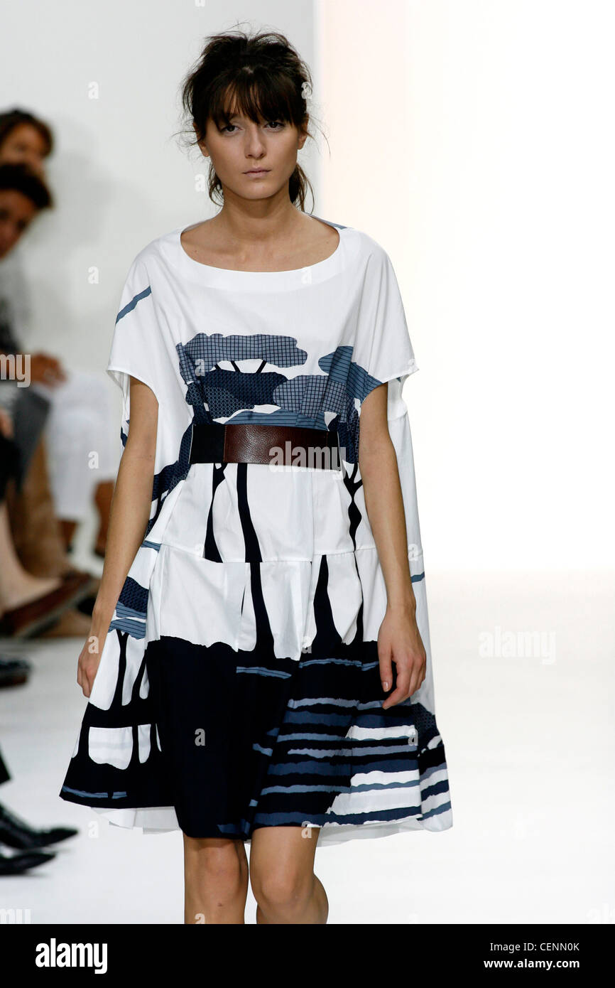 Marni Milan Ready to Wear Spring Summer Model Irina Lazareanu wearing short sleeved white and blue knee length patterned dress Stock Photo