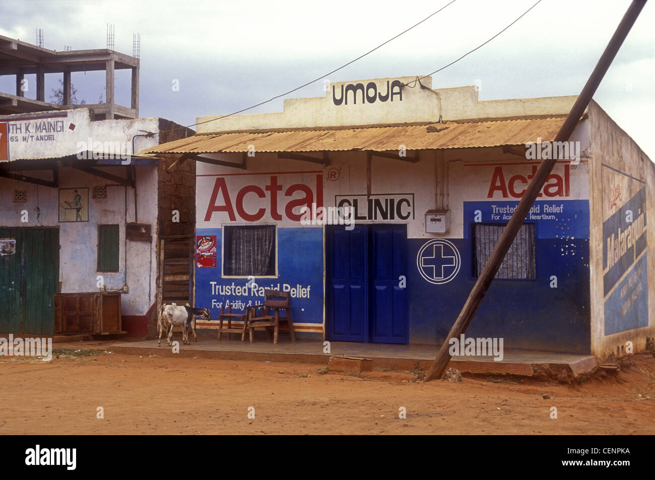 Rural 'Third world' Umoja Health Clinic Mtito Andei Kenya Africa with advertisments for Actal and Malaraquin Goats on verandah Stock Photo
