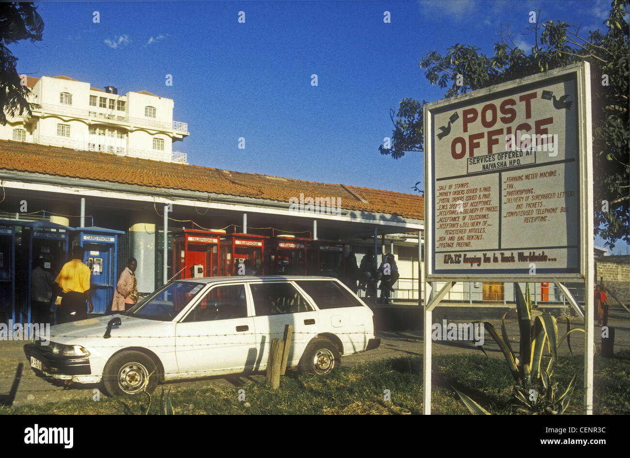 Naivasha Post Office and notice board with parked car and telephone