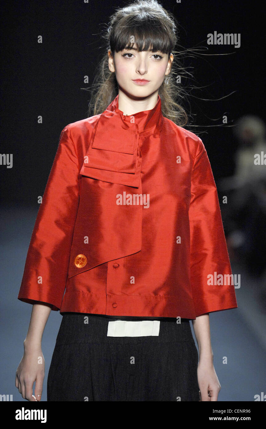 Diby John Galliano Haute Couture Paris autumn winter fashion show Model  wearing cap and strong pink blusher and red lipstick Stock Photo - Alamy