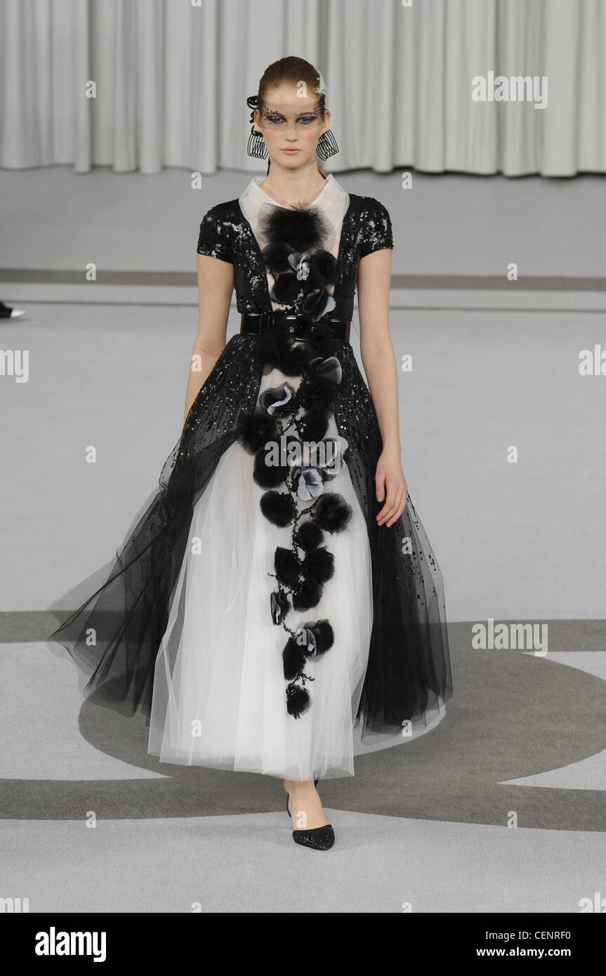 Paris Haute Couture Chanel Spring Summer Model blonde hair off face white  feathers wearing jewelled black net across eyes and Stock Photo - Alamy