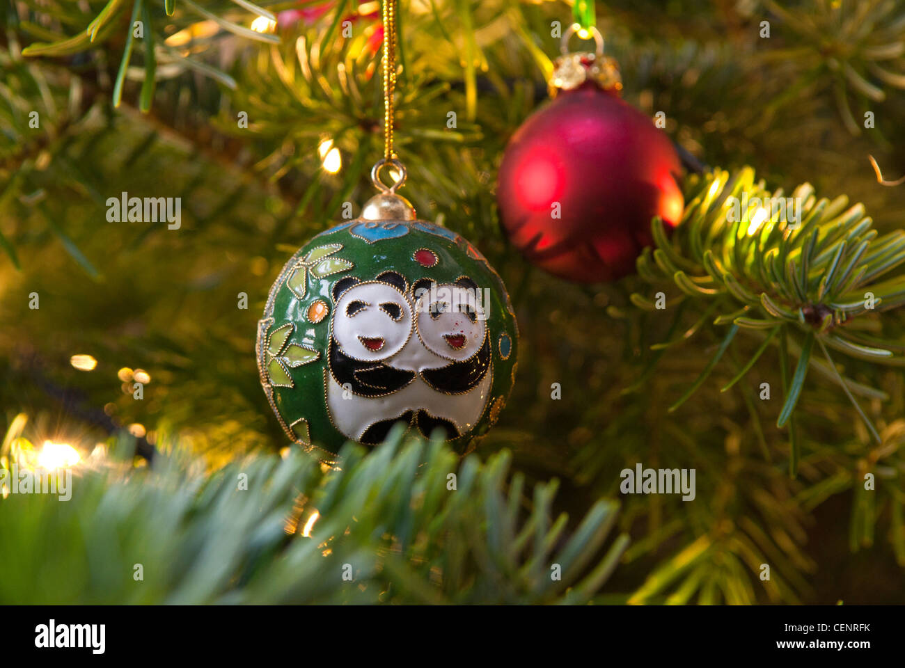 A real Christmas tree with baubles and decorations. Stock Photo