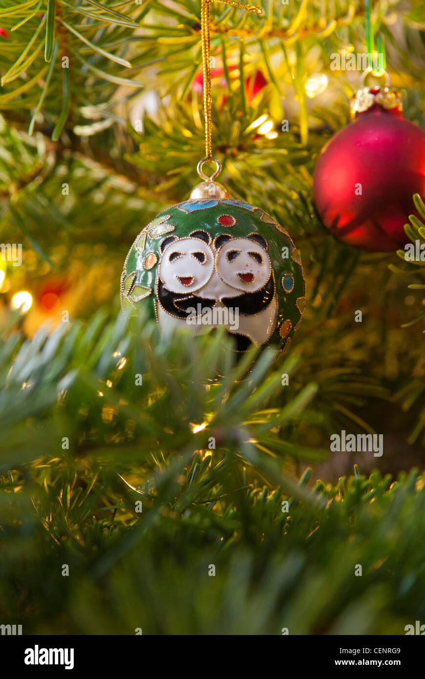 A real Christmas tree with baubles and decorations. Stock Photo