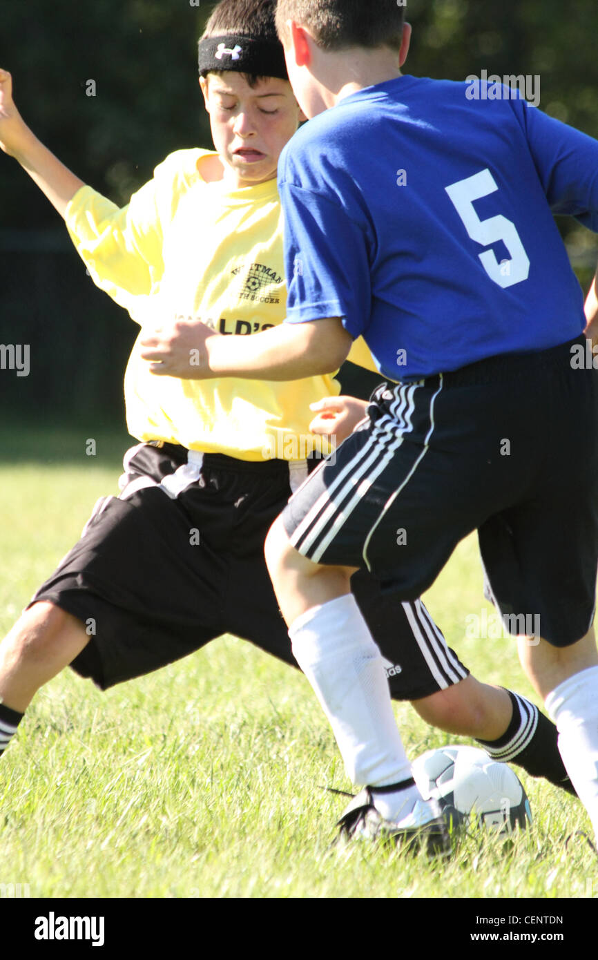 boys Soccer U12 in Fall battling for the ball Stock Photo Alamy