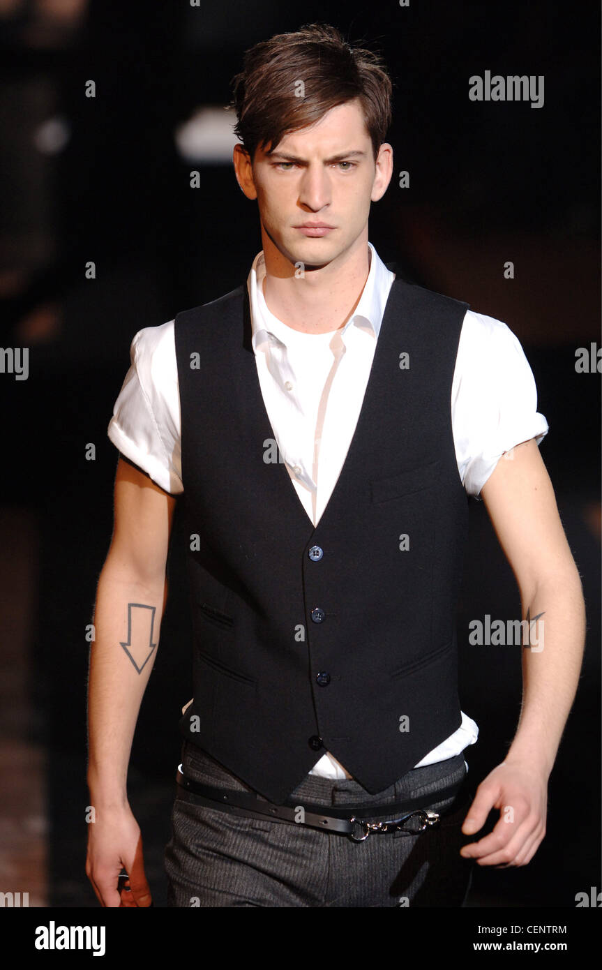 Lindeberg Menswear Milan A W Dark blonde male wearing a white button down  short sleeve shirt under a black vest Worn grey Stock Photo - Alamy