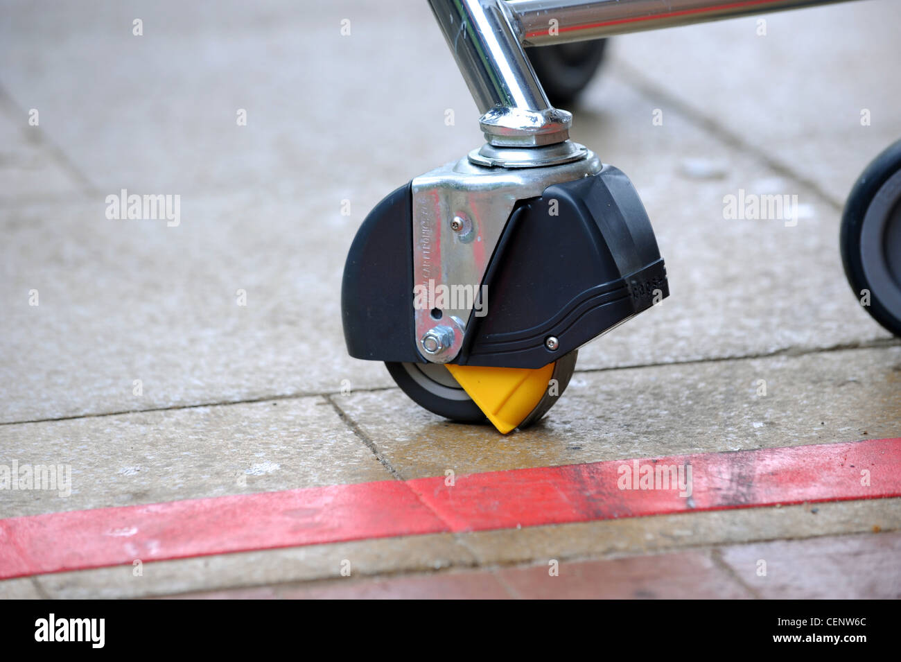 Sainsbury's trolley fitted with the Carttronics Caps system which activates a cap over the wheel