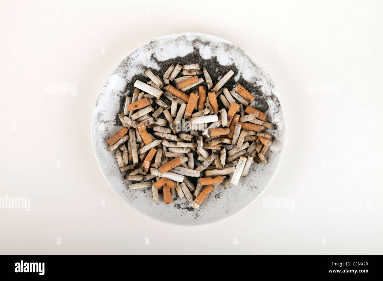 Cigarettes on a plate Stock Photo