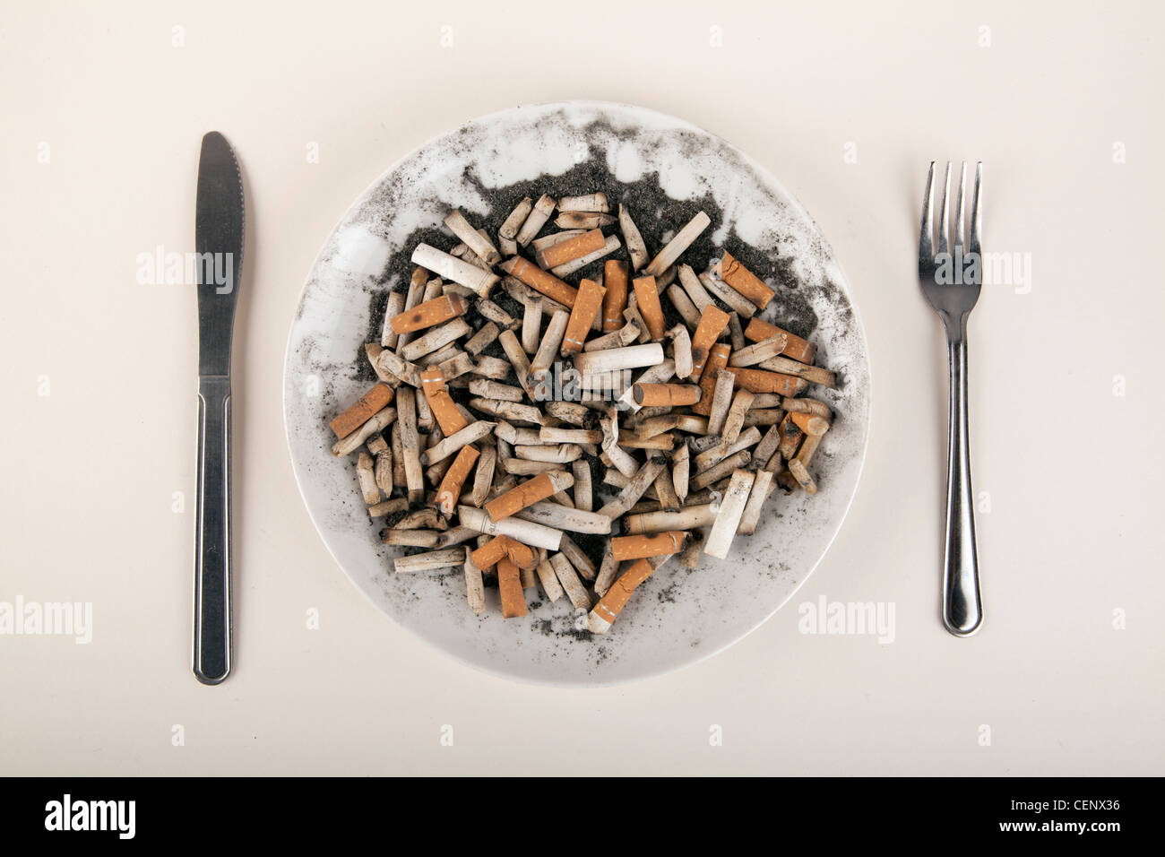 Cigarettes on a plate Stock Photo - Alamy
