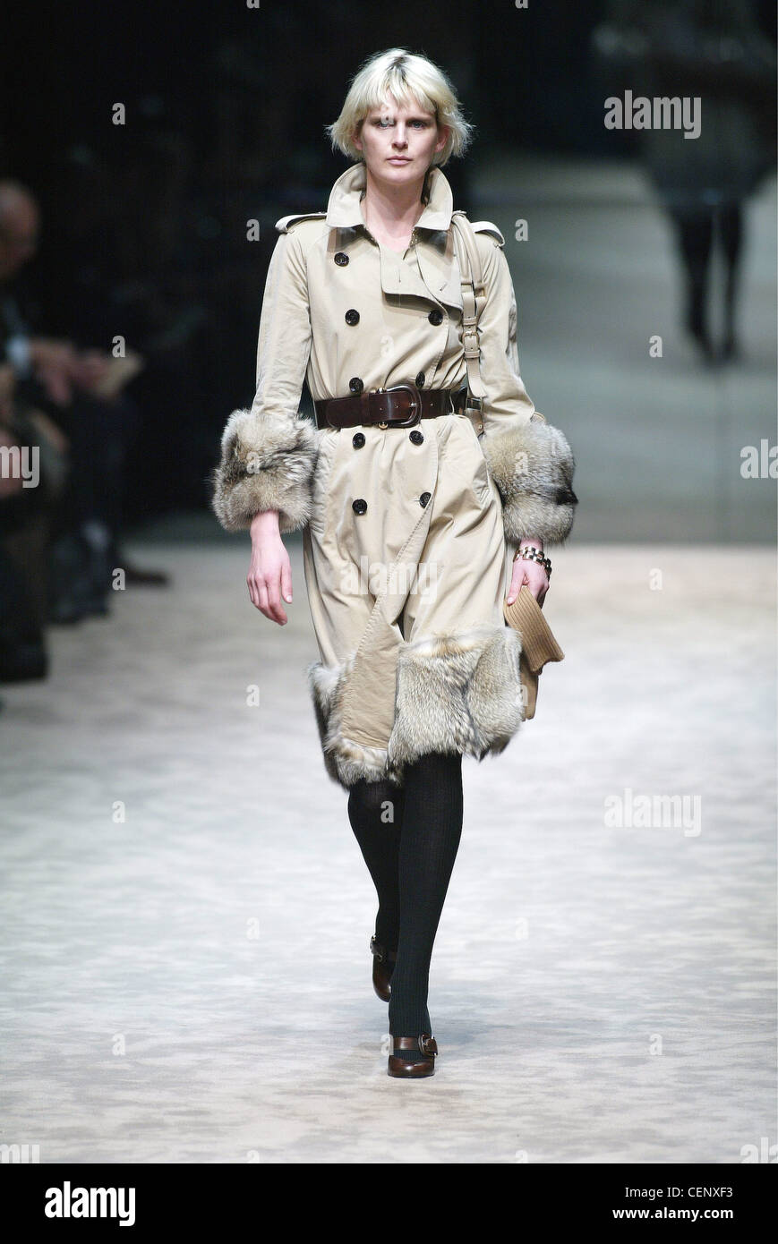 Burberry Ready to Wear Milan A W British model Stella Tennant wearing a  classic mac with bands of fox fur at the hem and cuff Stock Photo - Alamy