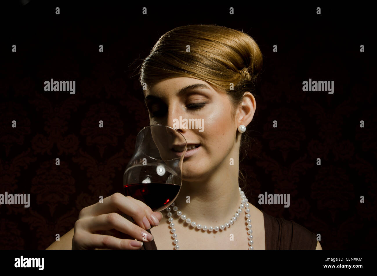 Young woman with a glass of red wine Stock Photo - Alamy