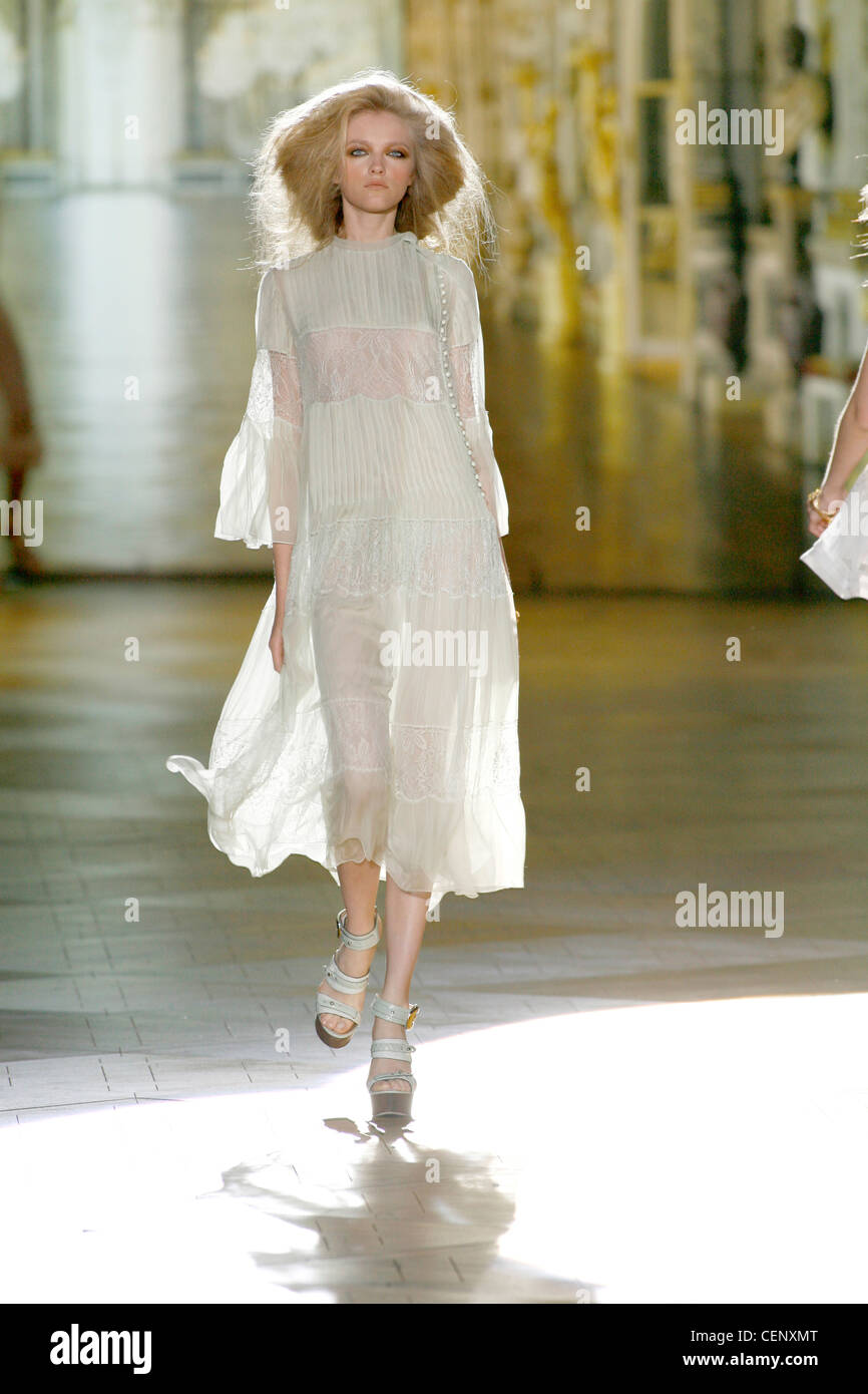 Roberto Cavalli Milan Ready to Wear S S Model Carmen Kass very long blonde  wavy hair wearing white ruffled sleeveless blouse Stock Photo - Alamy