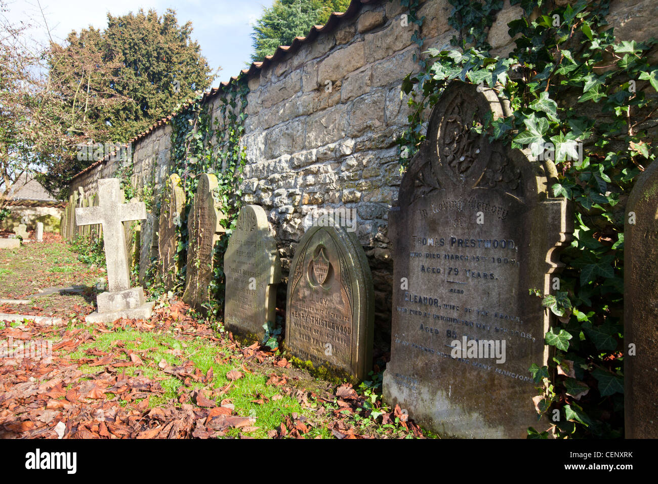 Branston cemetery is the location for these grave headstones lined up against the wall Stock Photo