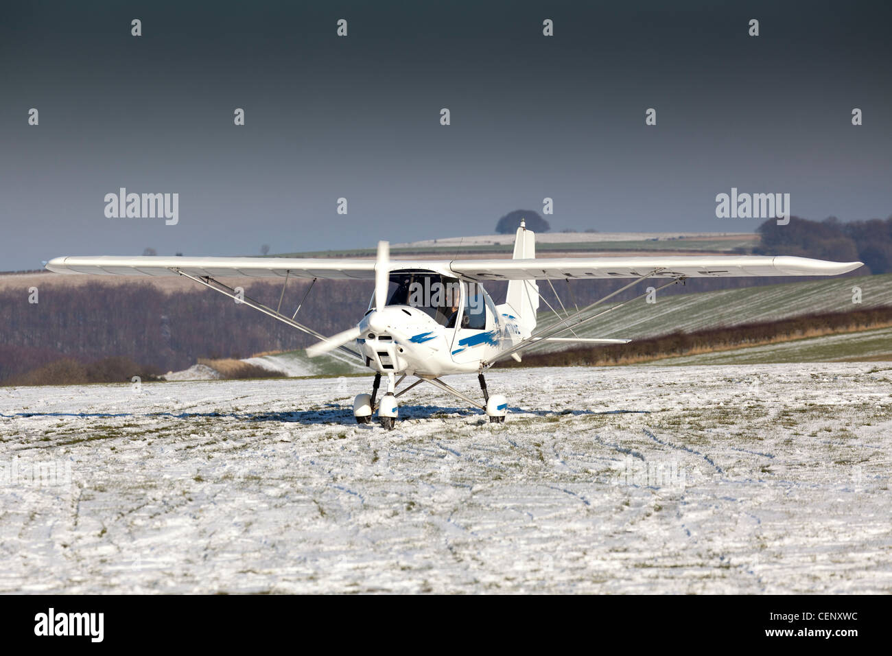 A C42 Ikarus microlight aircraft at Compton Abbas airfield in Dorset in England in snow Stock Photo