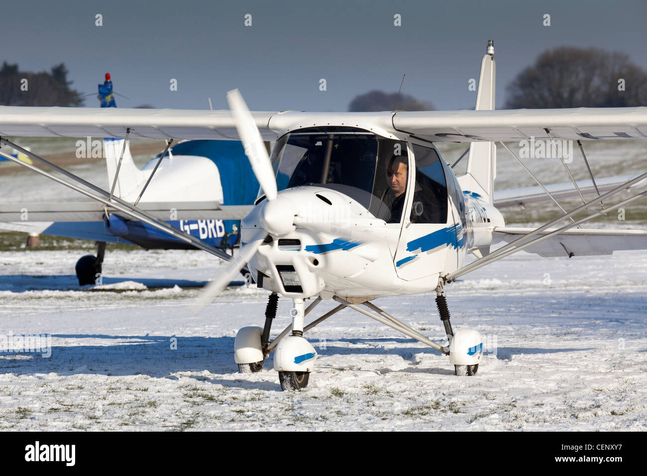 A C42 Ikarus microlight aircraft at Compton Abbas airfield in Dorset in England in snow Stock Photo