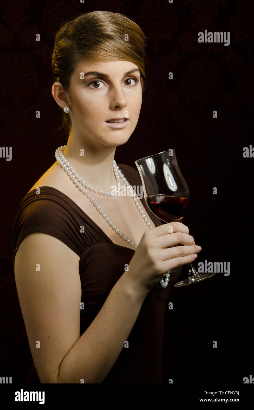 Young woman with a glass of red wine Stock Photo - Alamy