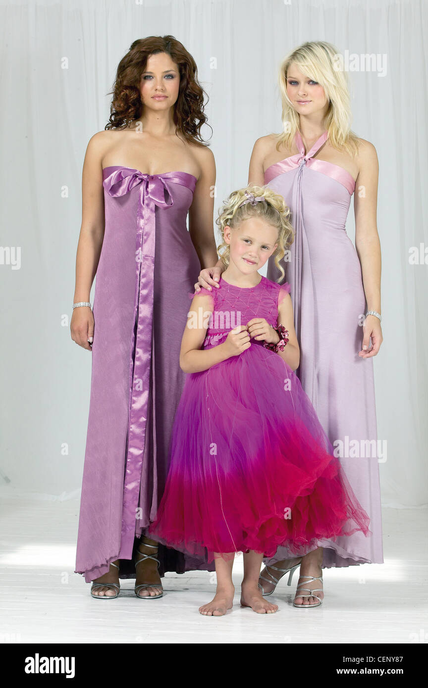 A Brunette Female Bridesmaid Curly Hair Wearing A Lilac Satin