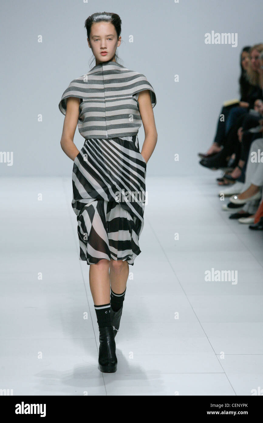 Rick Owens Ready to Wear Spring Summer Monochrome Stripes: back to front style striped oufit cropped jacket and Zebra stripe Stock Photo