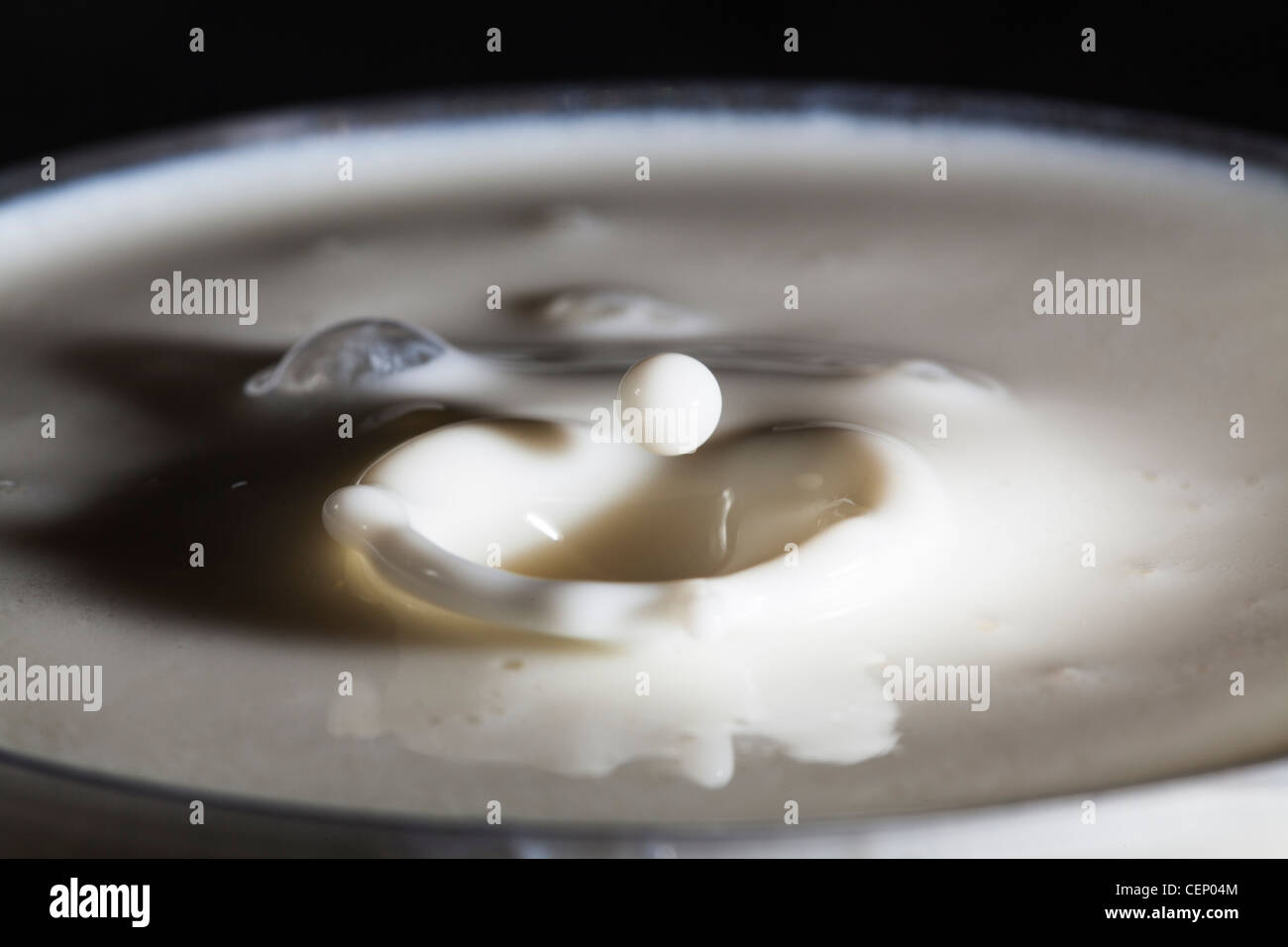 Shapes created by drops of milk and milk splashes Stock Photo