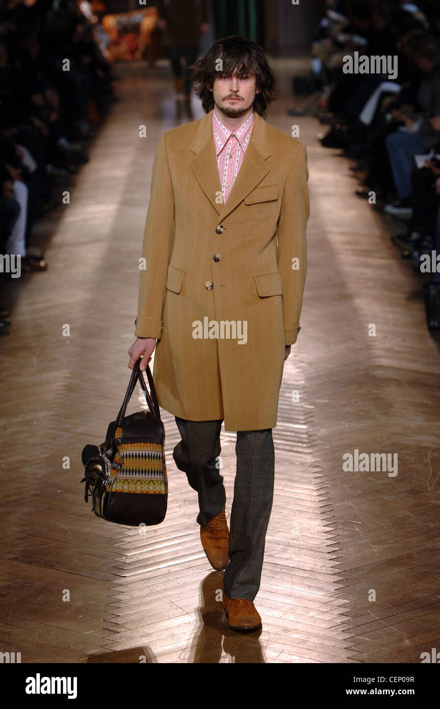Paul Smith Ready to Wear Menswear Paris A W Brunette male shaggy hair  wearing a brown knee length jacket over a pink button Stock Photo - Alamy