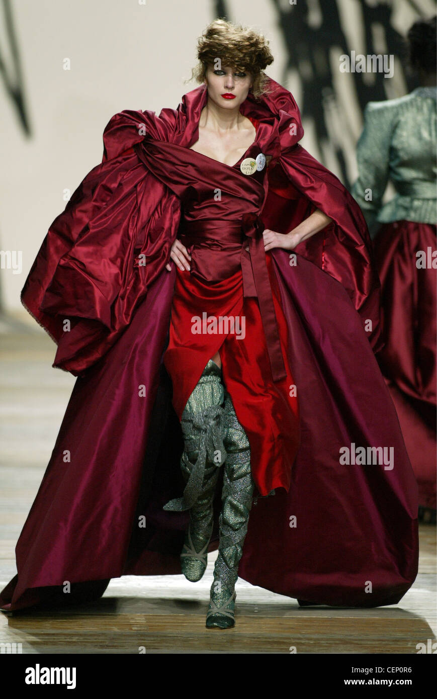 Vivienne Westwood Ready to Wear Paris A W Blonde female model her hair  piled on her head wearing a big puffy red dress huge Stock Photo - Alamy