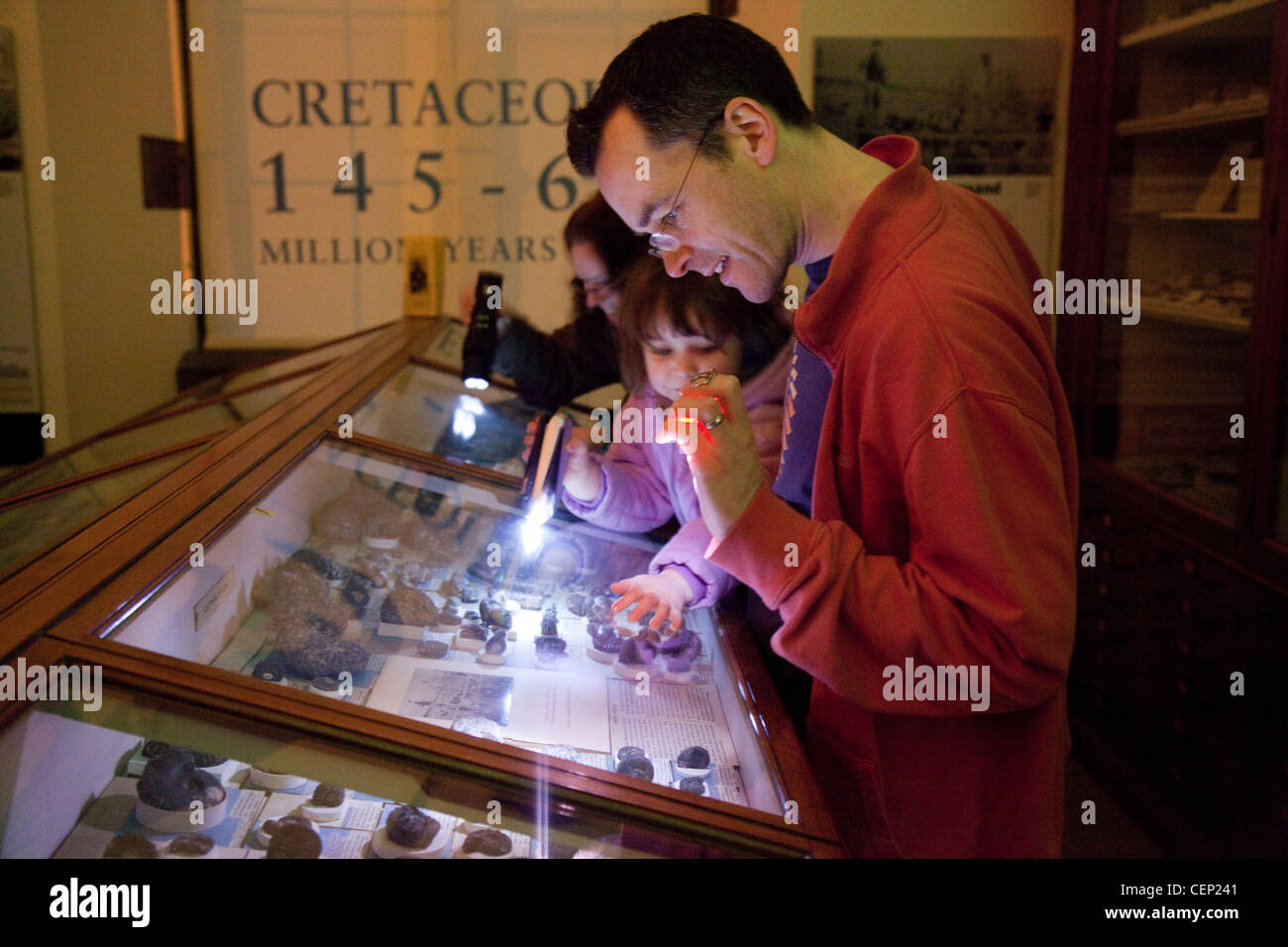 family looking a fossils, Sedgwick museum of Earth Sciences Cambridge UK Stock Photo