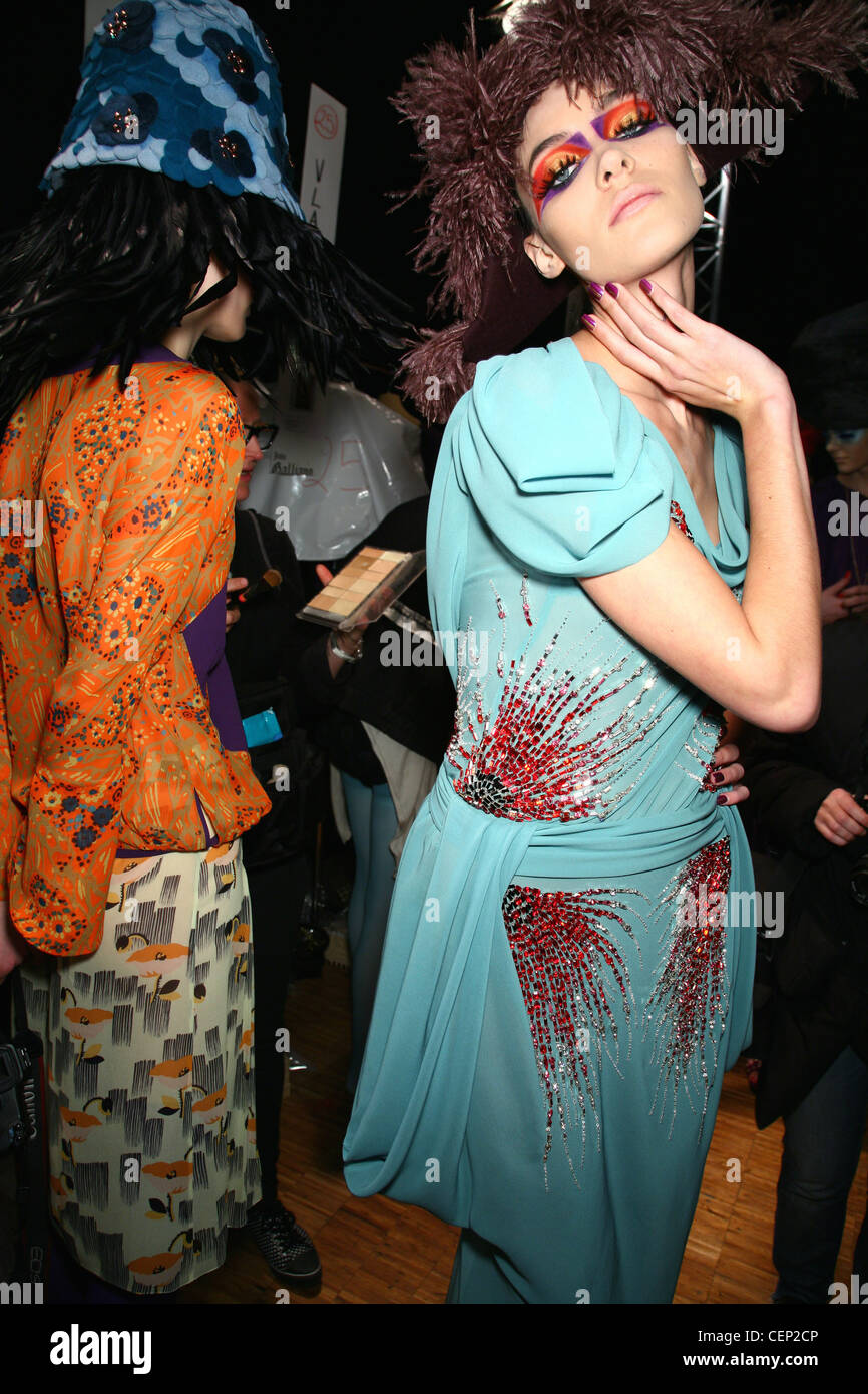 Backstage John Galliano Paris Ready to Wear Autumn Winter 2008 2009 Model wearing a bright light blue dress red sequin patterns Stock Photo