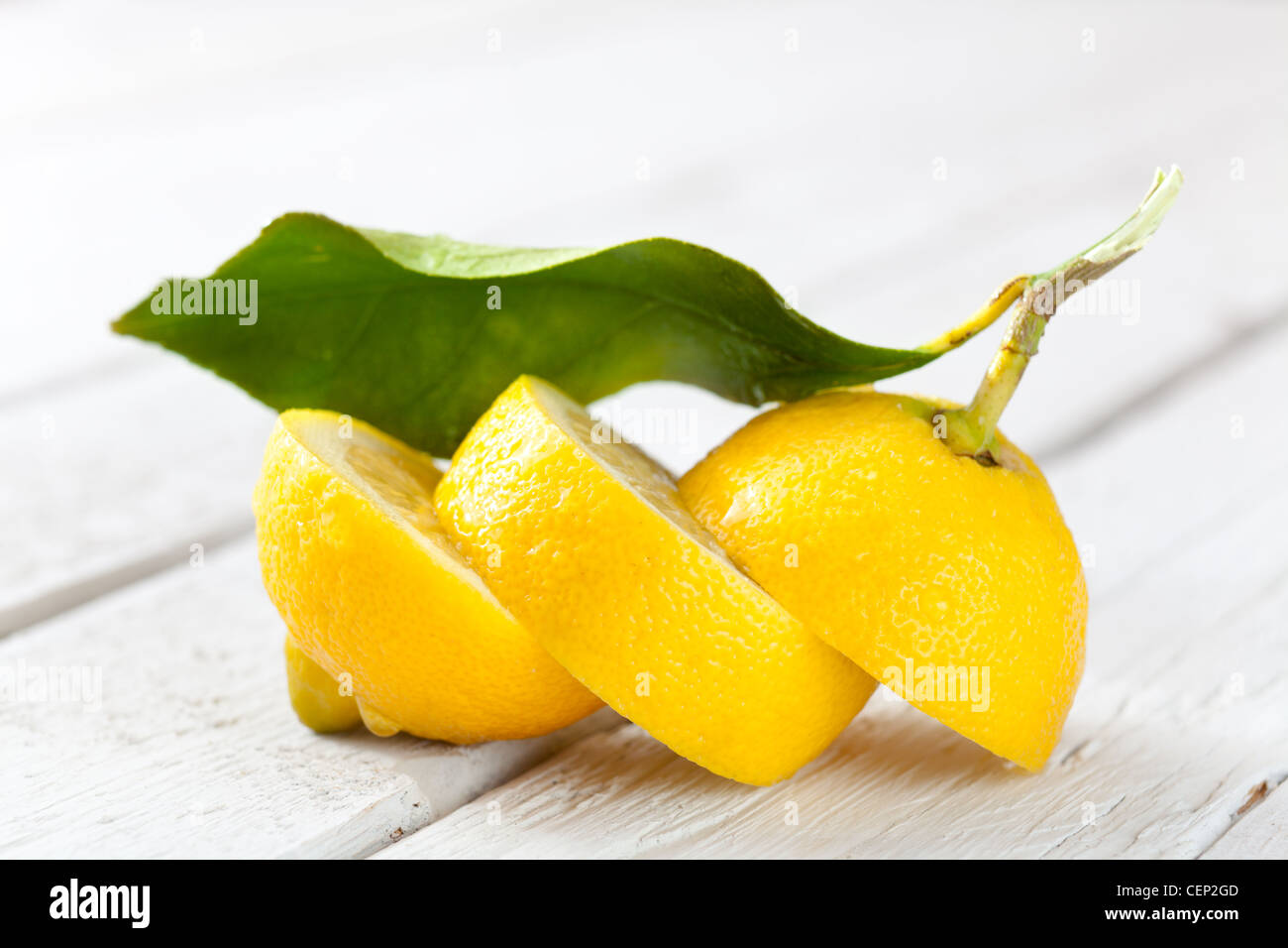 Sliced Lemon on White Wood Stock Photo