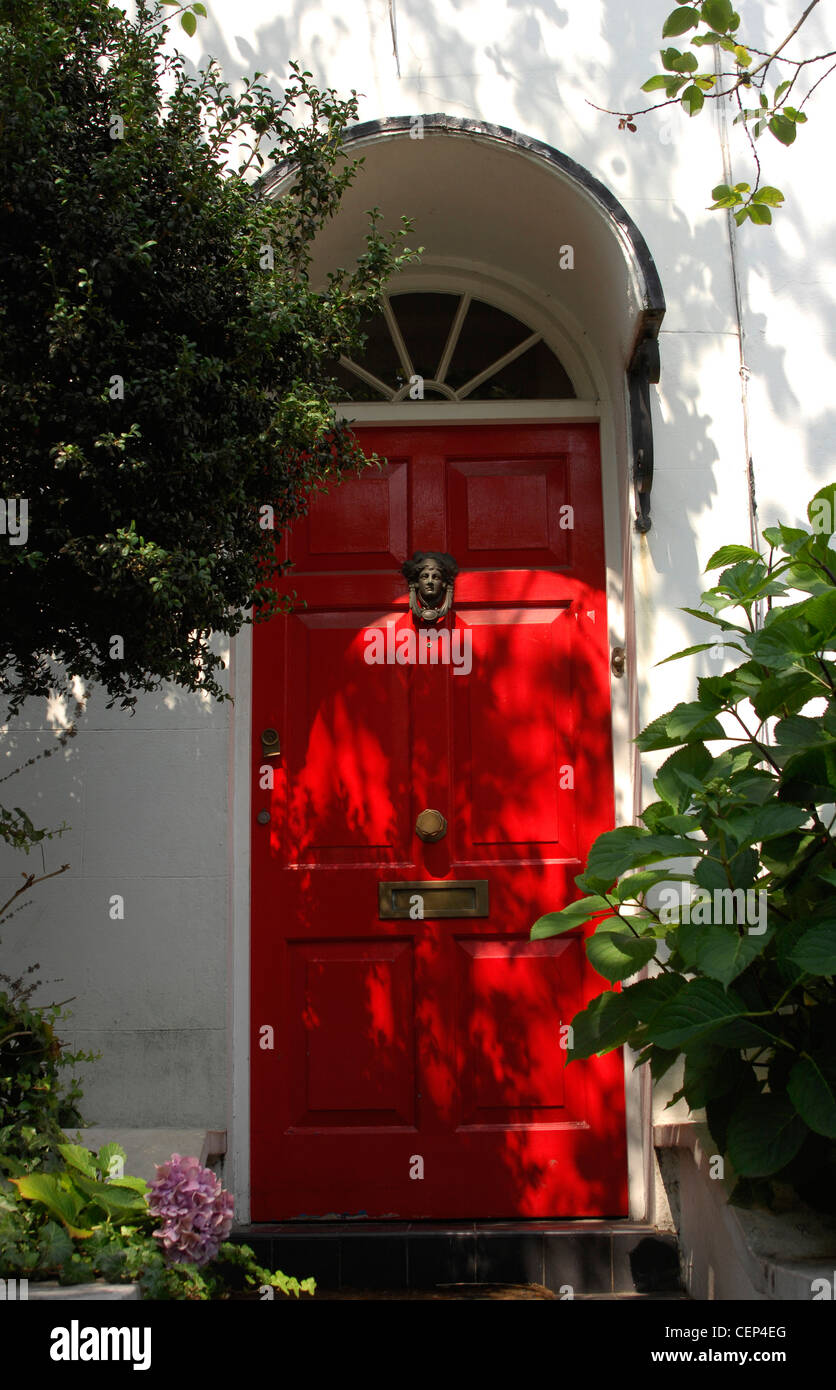 Bright Red Front Dowith Brass Head Shaped Knocker Letterbox