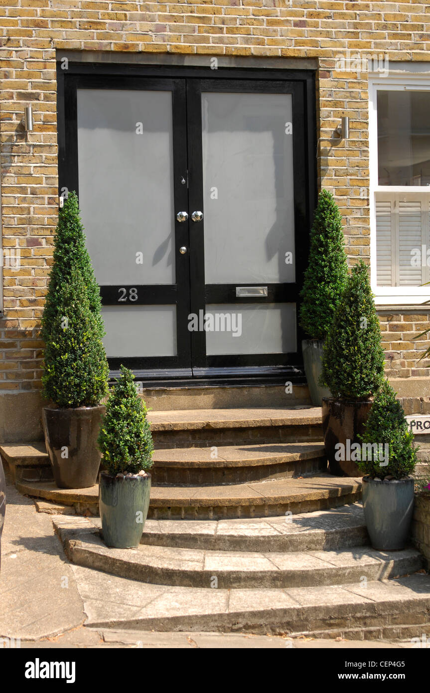 Double Glass And Black Front Doto A Brick House With Steps