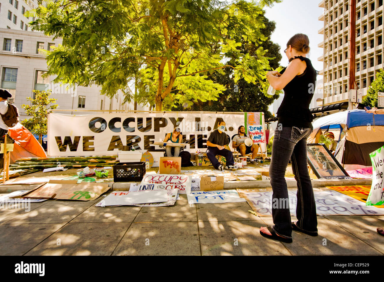 A large sign expresses the We-Are-the-99% anti-capitalism sentiments of Occupy Wall Street protesters at Los Angeles City Hall. Stock Photo