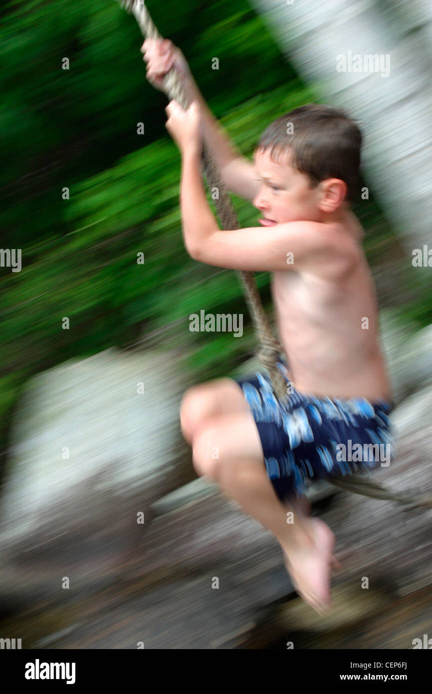 boy on Rope Swing Sebago Lakes, Maine Stock Photo Alamy