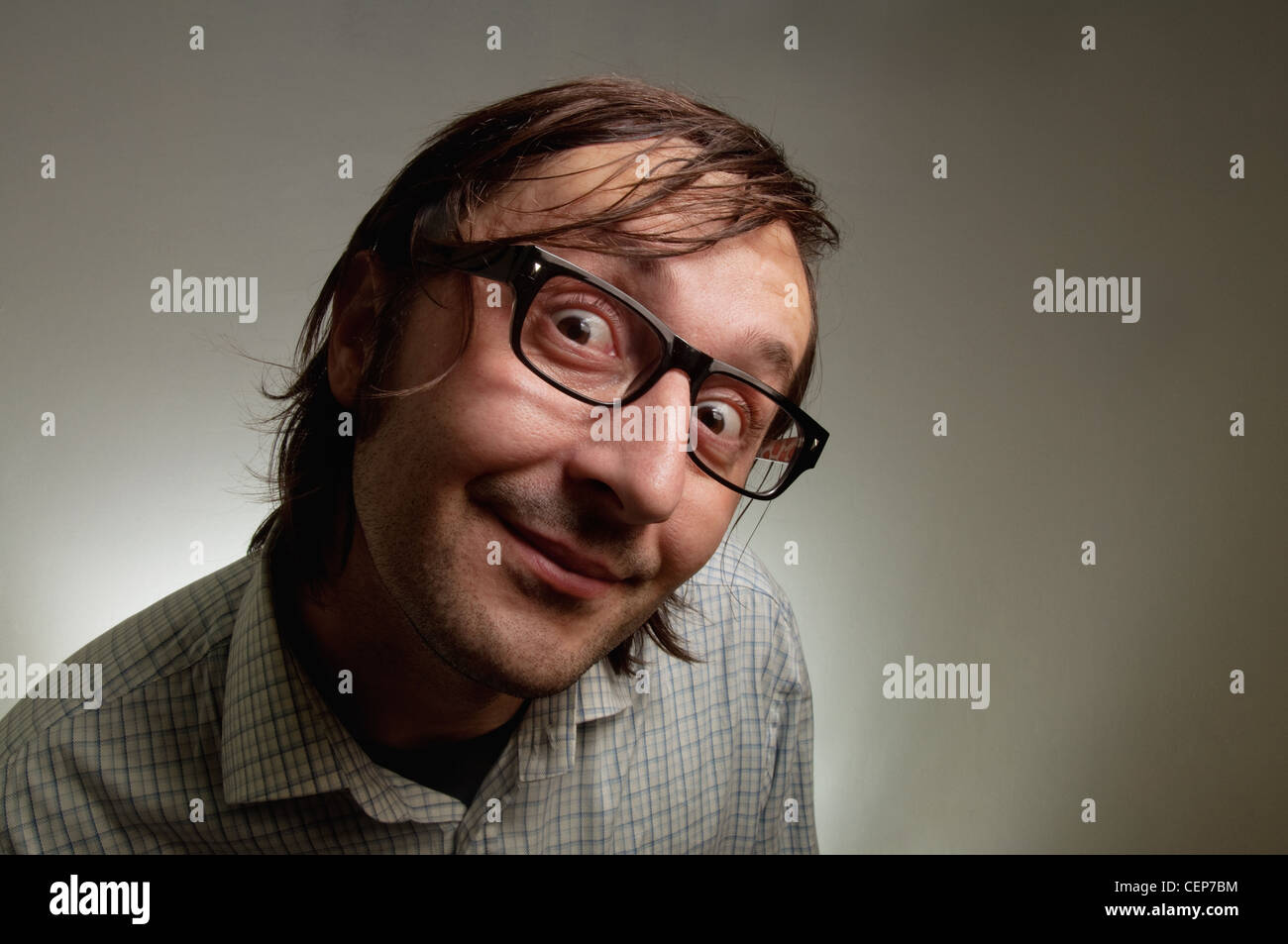 Big head nerd male close up portrait, this image is a humorous concept photo. Stock Photo