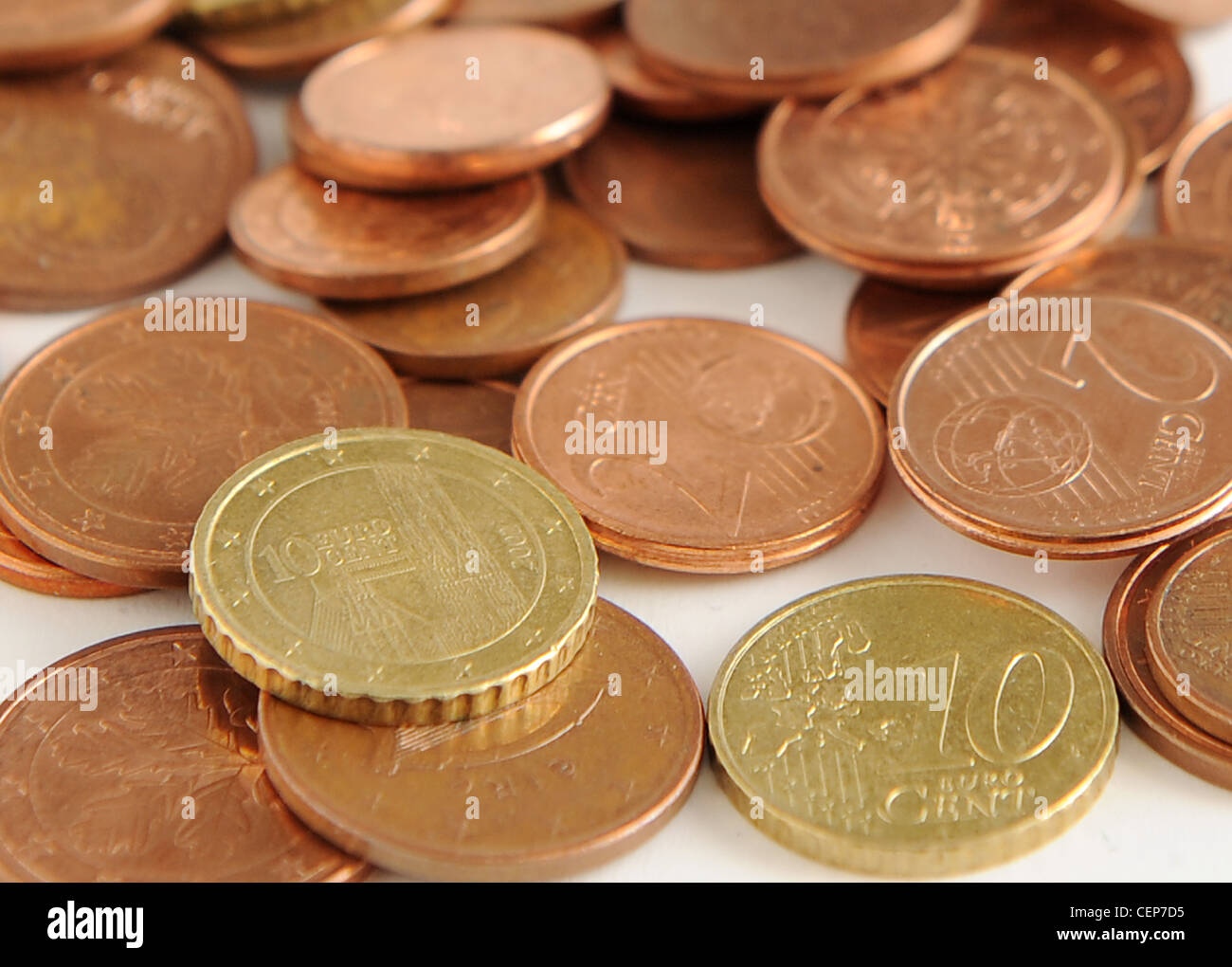 A still life image of Euro cent coins scattered on the white table Stock Photo
